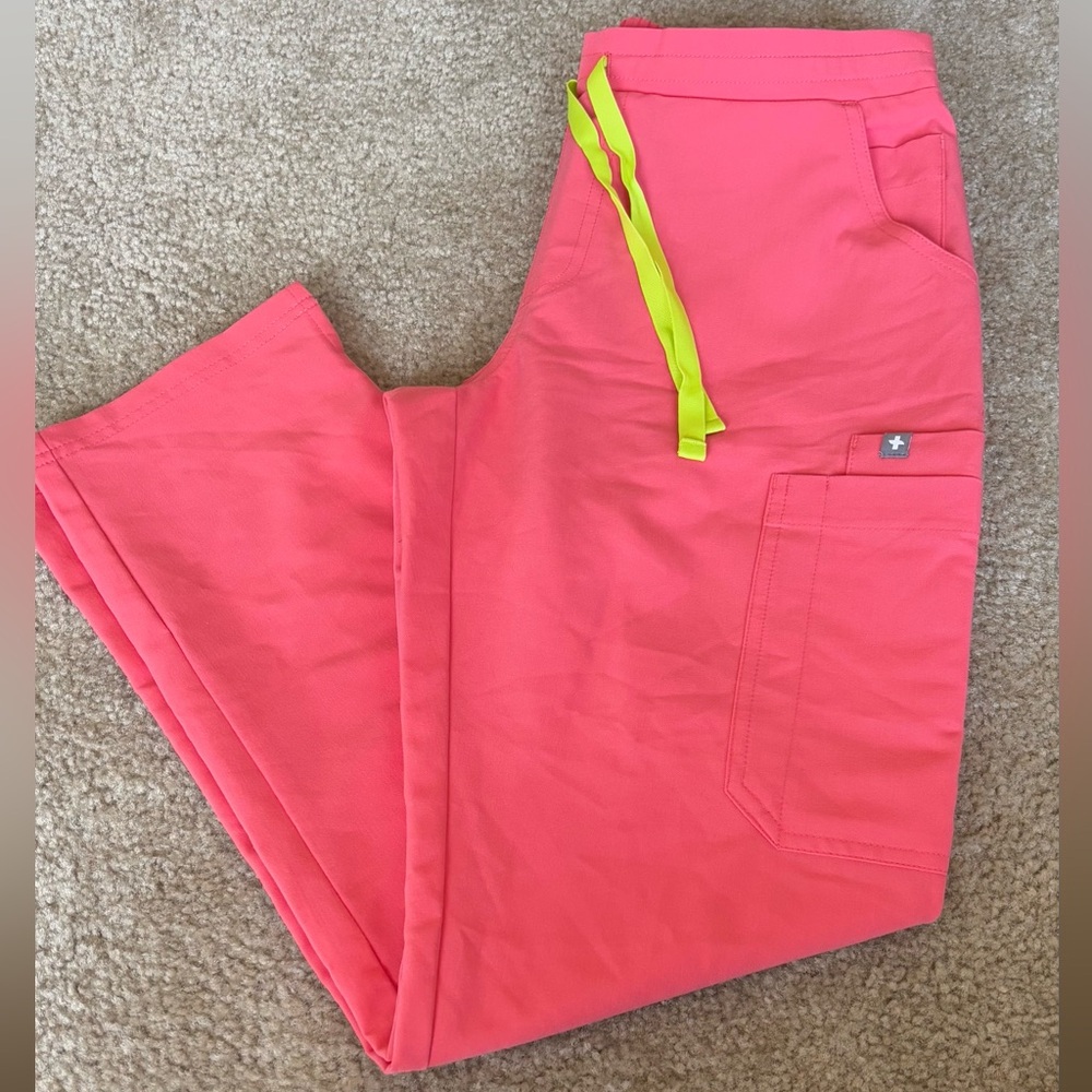 FIGS Hot Coral Yola scrub pants.